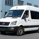 Front three-quarter view of white TOURWAY T6 commercial vehicle