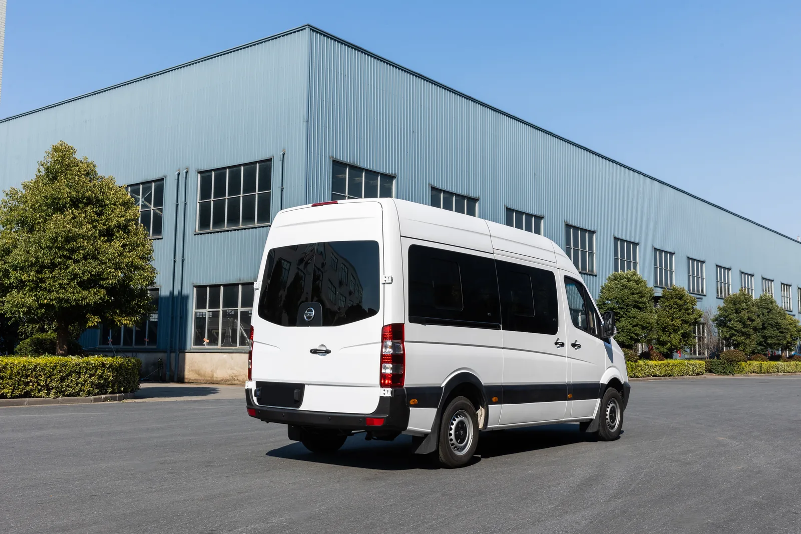 Rear three-quarter view of white TOURWAY T6 commercial vehicle