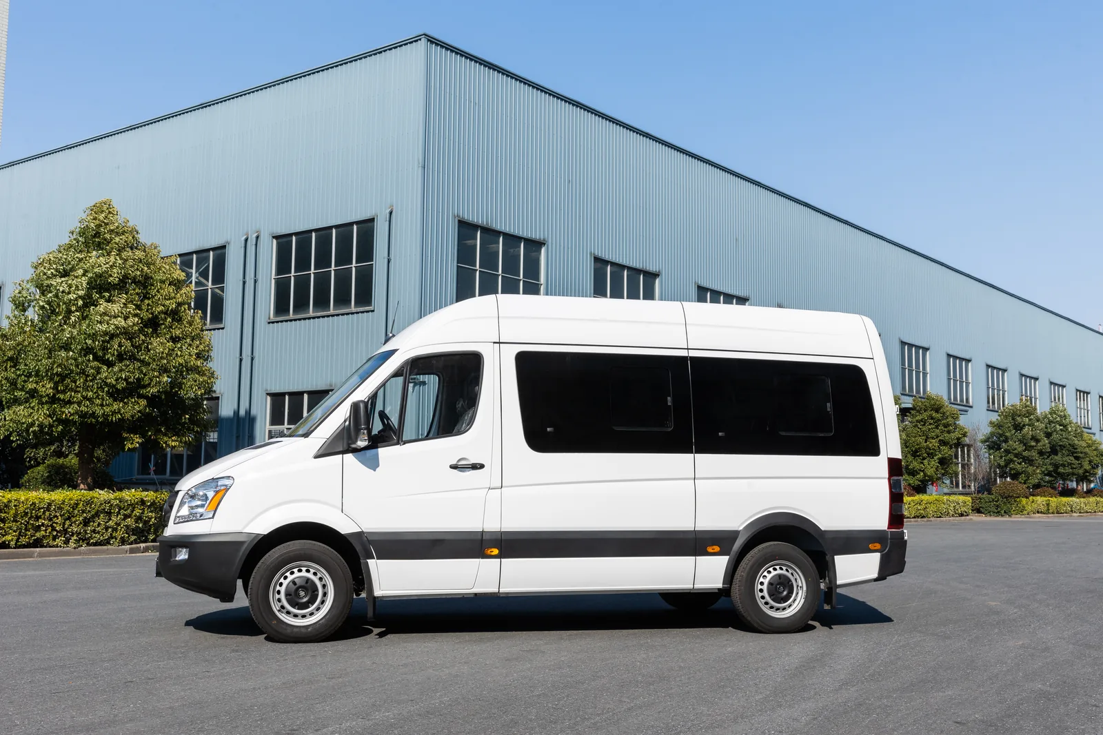 Left side view of white TOURWAY T6 commercial vehicle