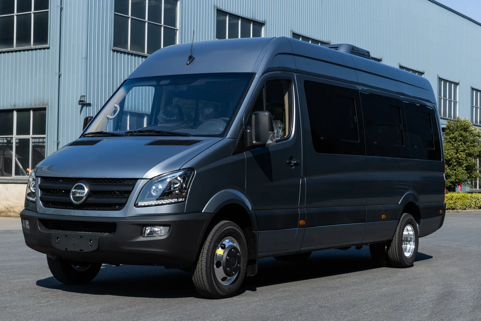 Front three-quarter view of gray TOURWAY T7 commercial vehicle