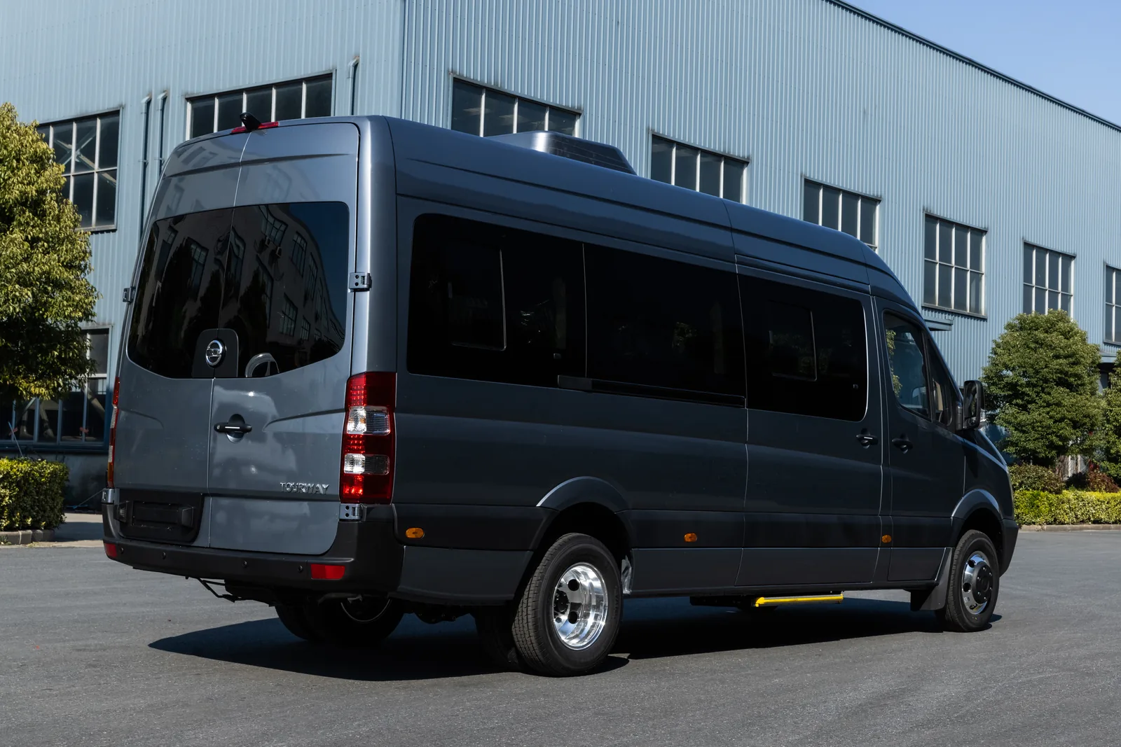 Rear three-quarter view of gray TOURWAY T7 commercial vehicle
