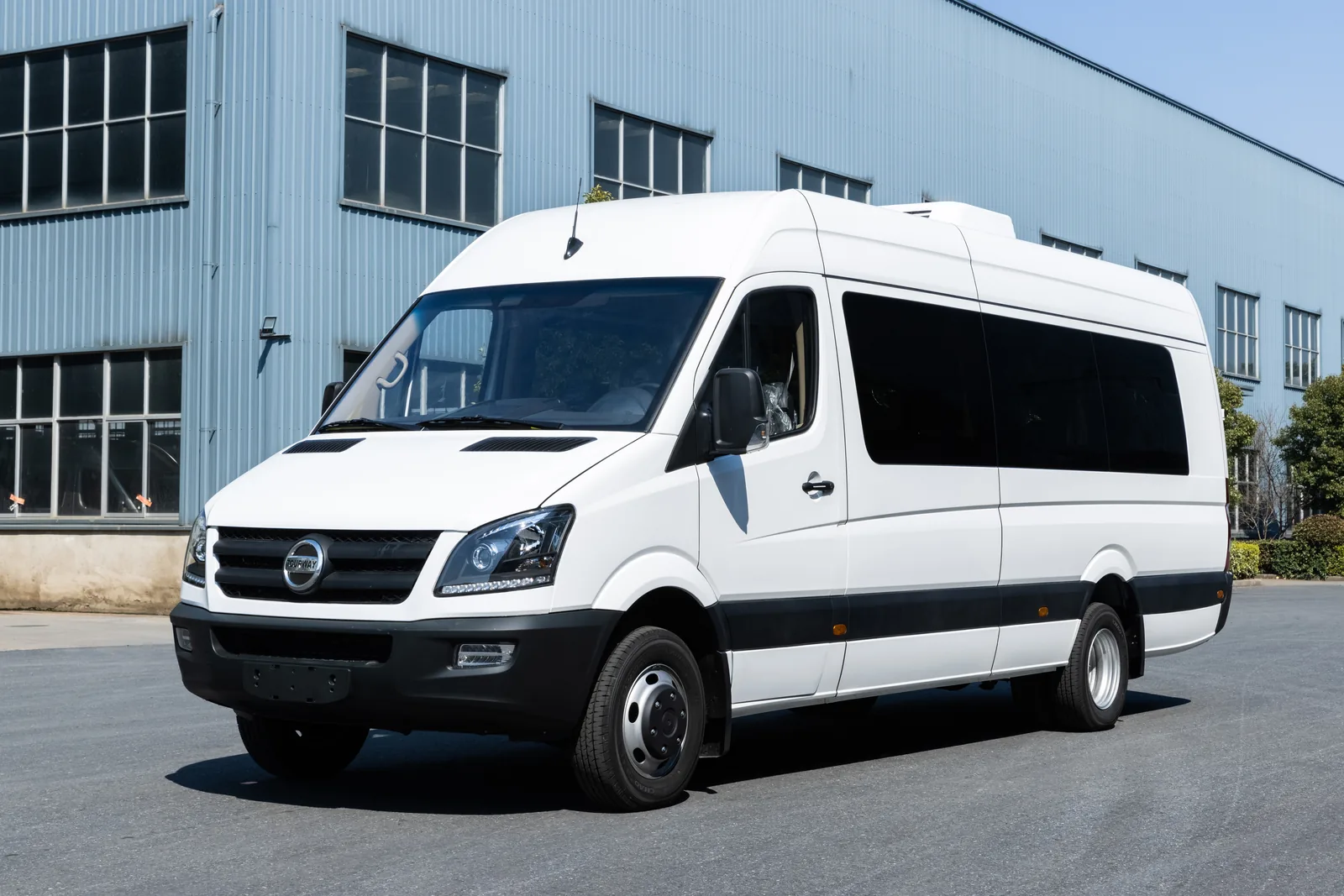 Front three-quarter view of white TOURWAY T8 commercial vehicle
