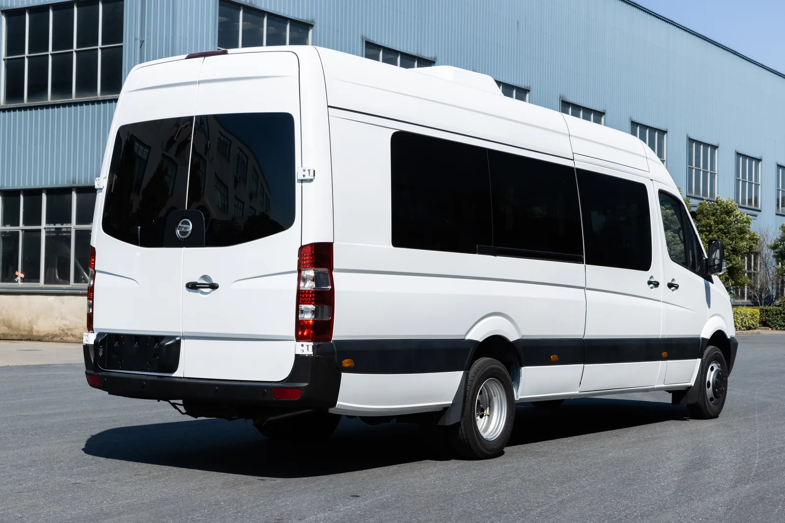 Rear three-quarter view of white TOURWAY T8 commercial vehicle