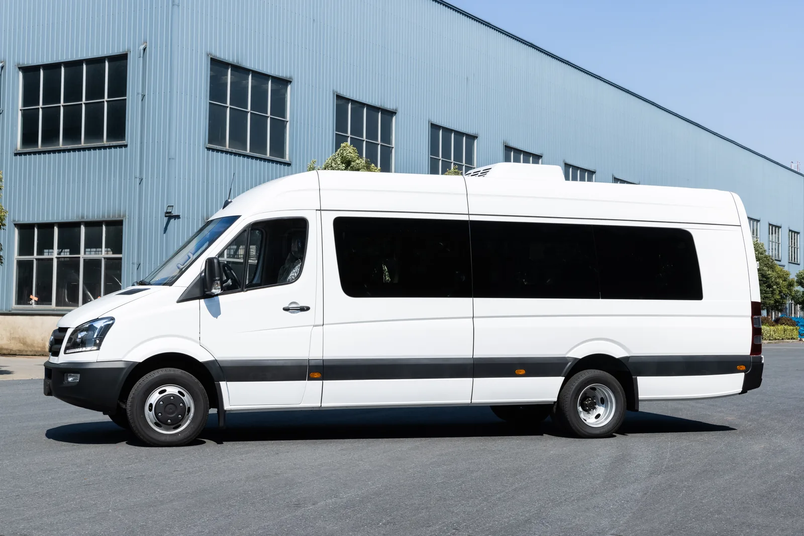 Left side view of white TOURWAY T8 commercial vehicle